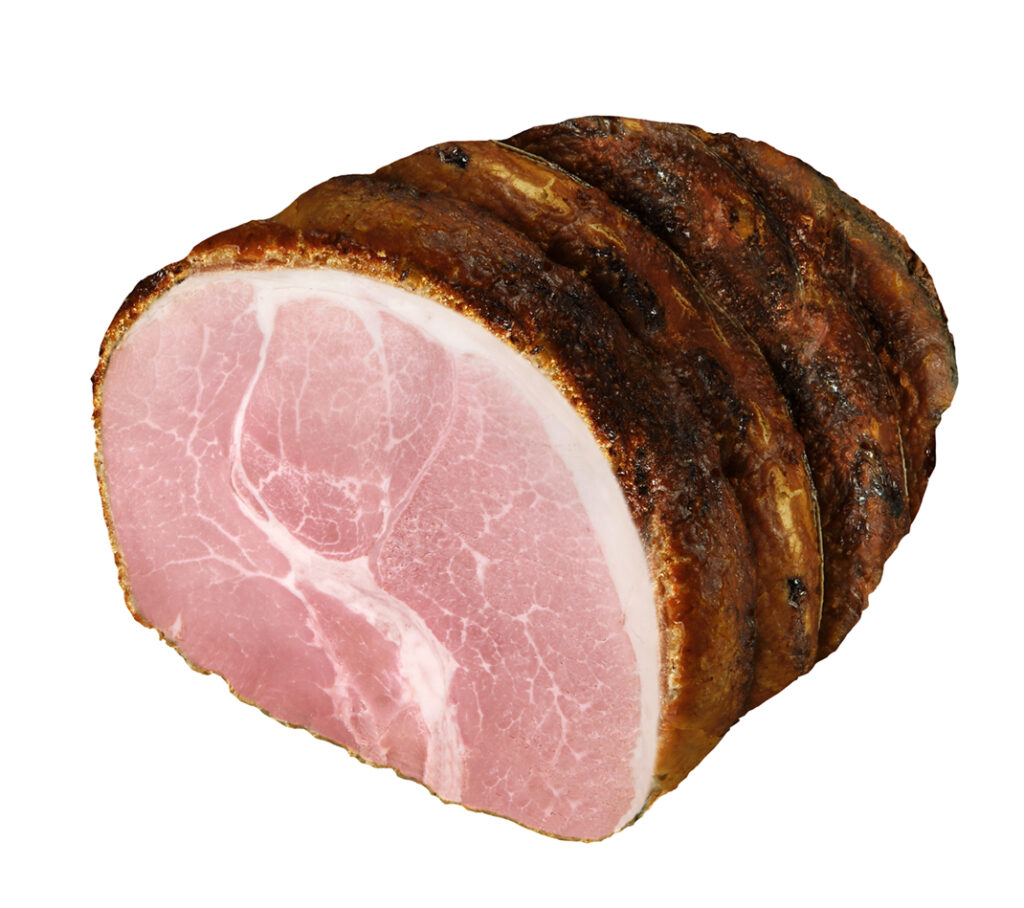 Roast ham cooked in the oven with sage and rosemary